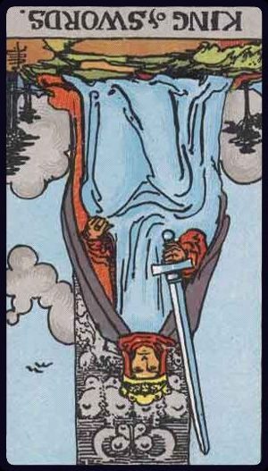 Rider-Waite-Smith tarot card depicting the King of Swords from the Suit of Swords, reversed position.