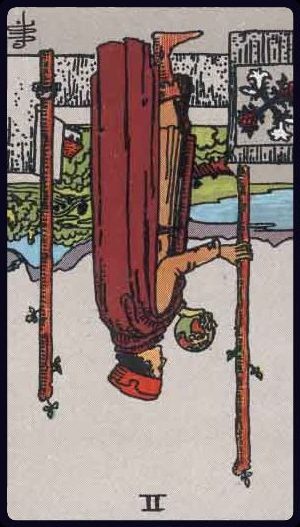 Rider-Waite-Smith tarot card image of the Two of Wands, reversed.